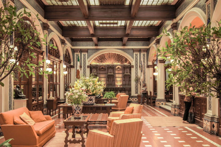 A living room filled with furniture and high ceilings.