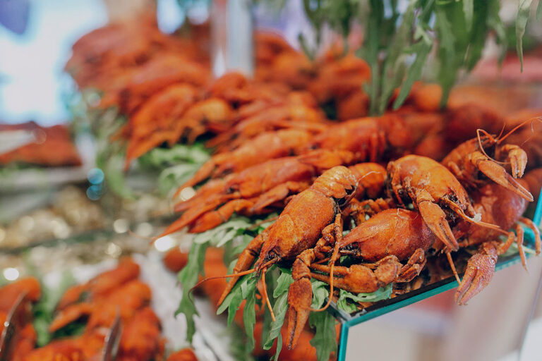 A display of crabs on the side of a table.