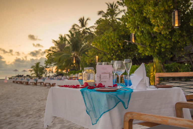 A table set up with plates and glasses on it