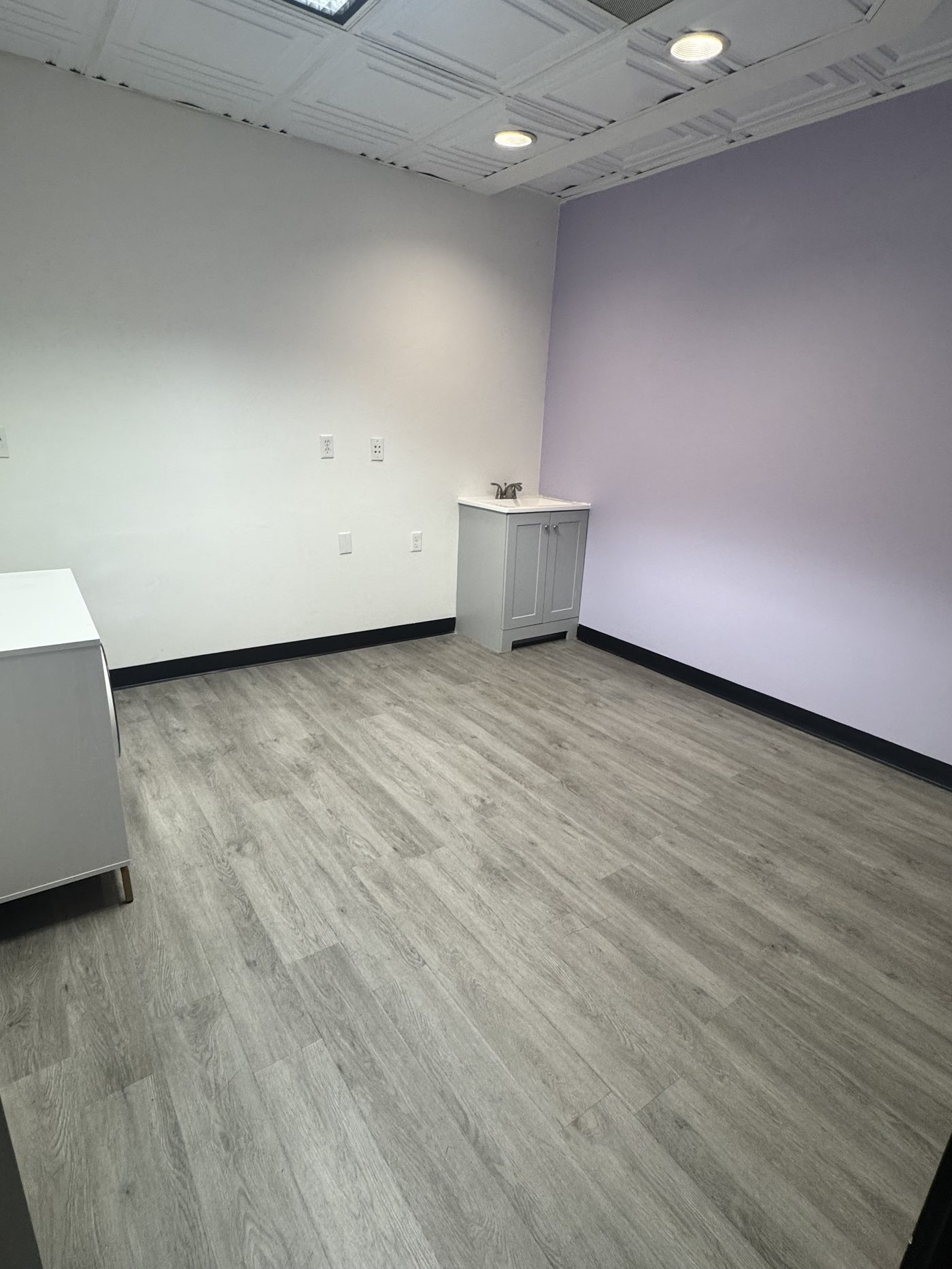 Private suite with accent wall at Elevae Suites