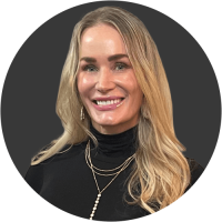 Smiling blonde woman wearing layered necklaces